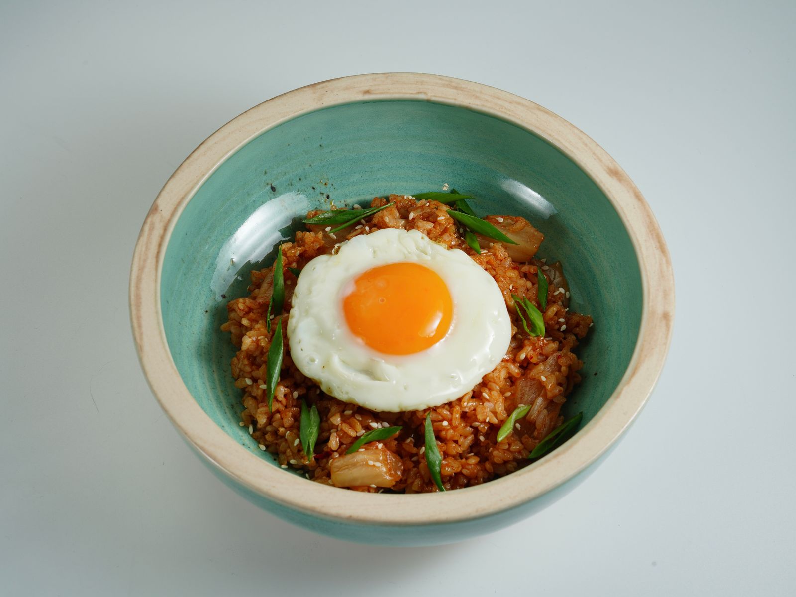 Kimchi fried rice topped with a sunny-side-up egg.