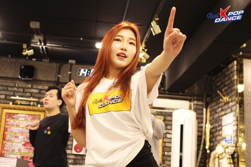 A Real K-pop Dance instructor demonstrates choreography during a Seoul class.