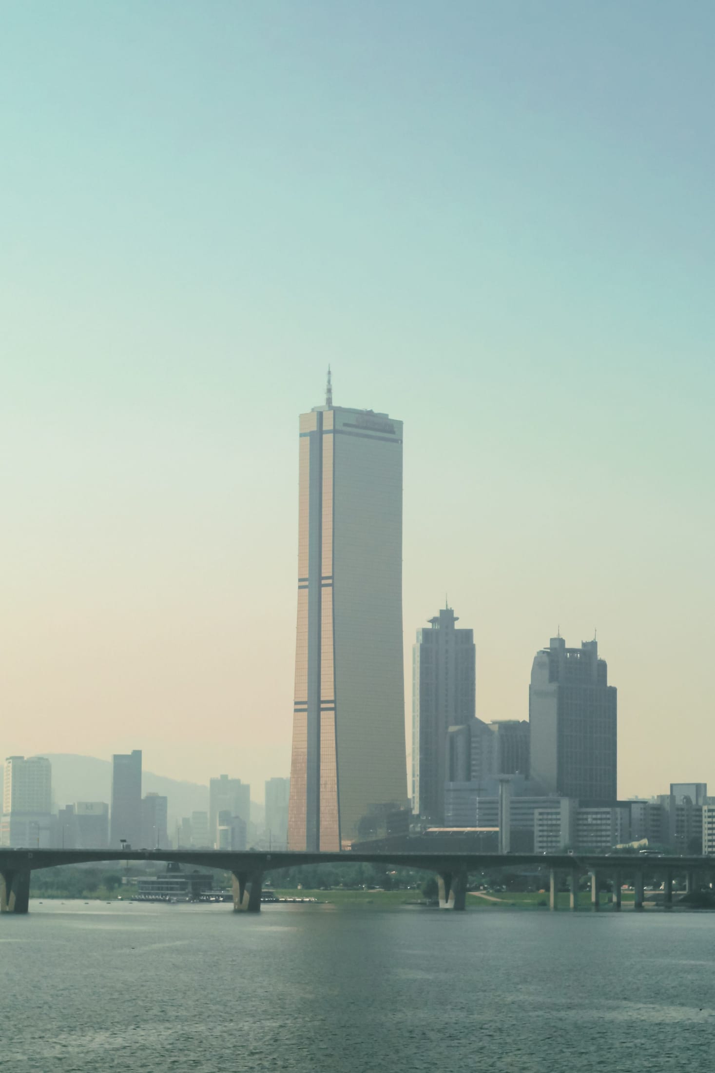 The 63 Building's distinctive gold-glass tower rising above the Han River in Yeouido, Seoul.