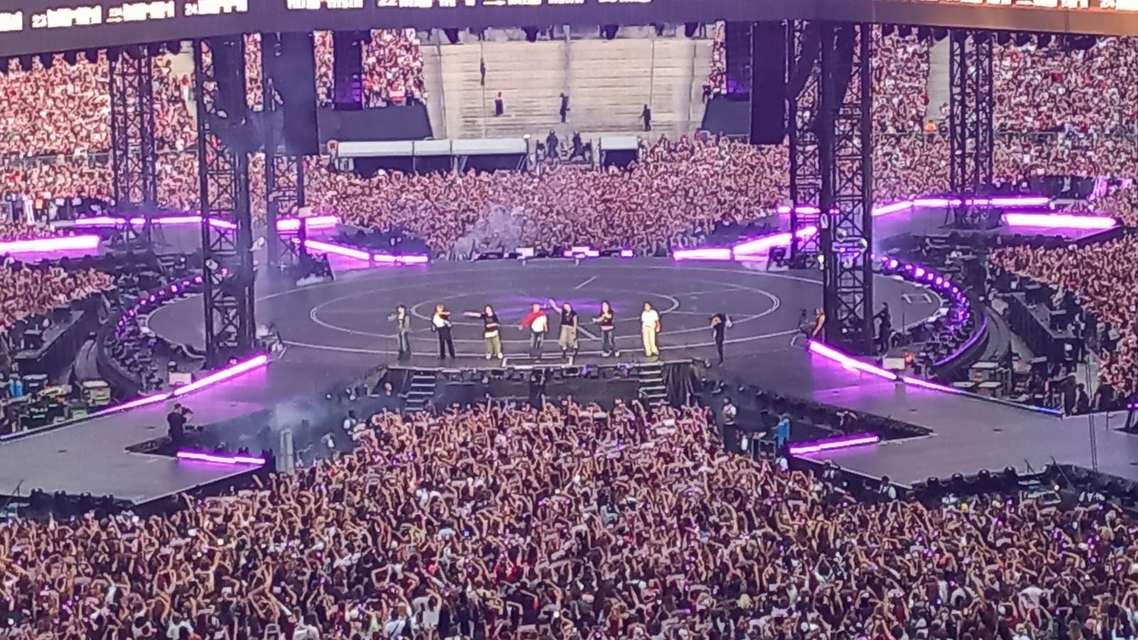 BTS performing on the center stage at Stade de France, Paris, July 17 2026 — two days before the World Cup Final.