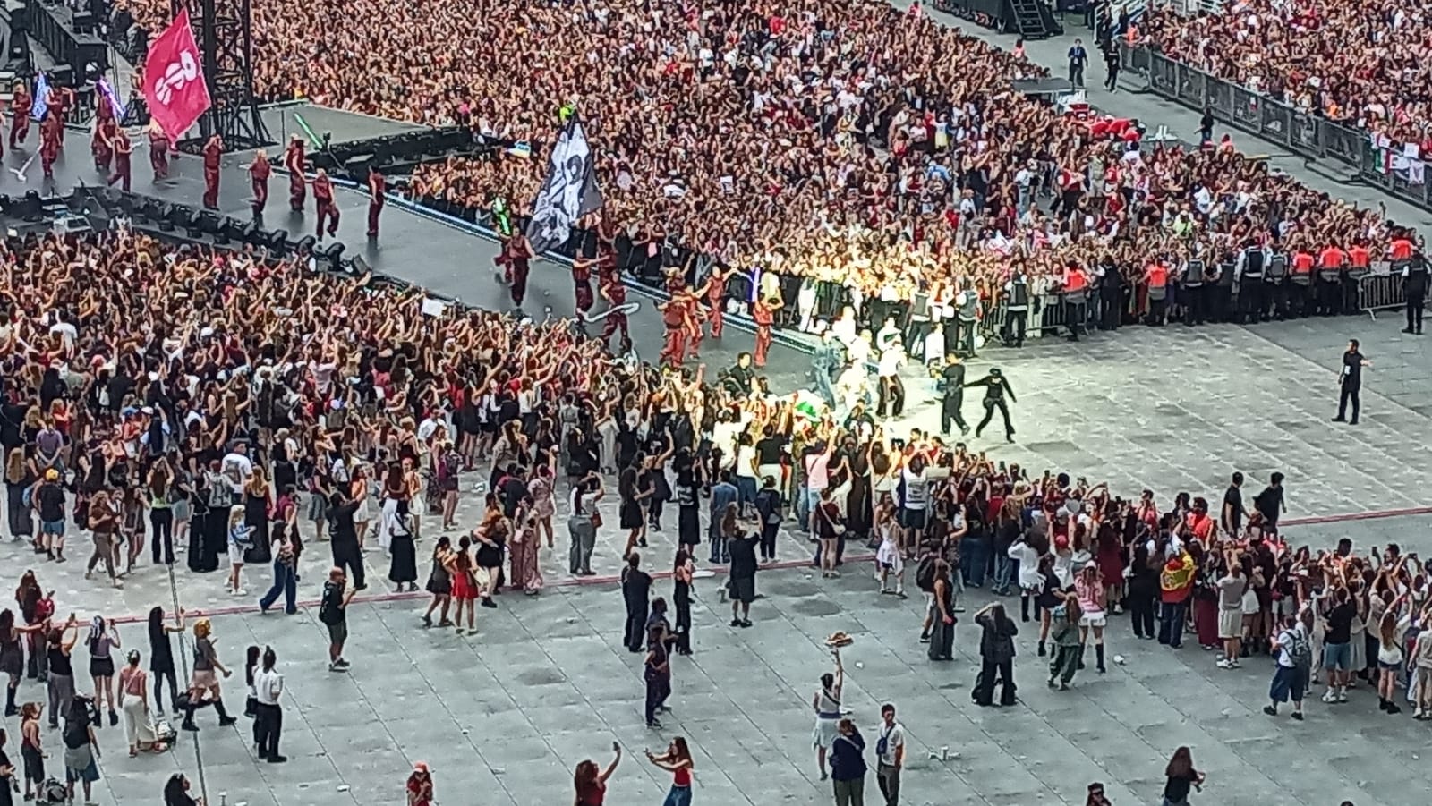 BTS walking the elevated runway through the crowd during "Idol," Stade de France, Paris, July 17 2026.