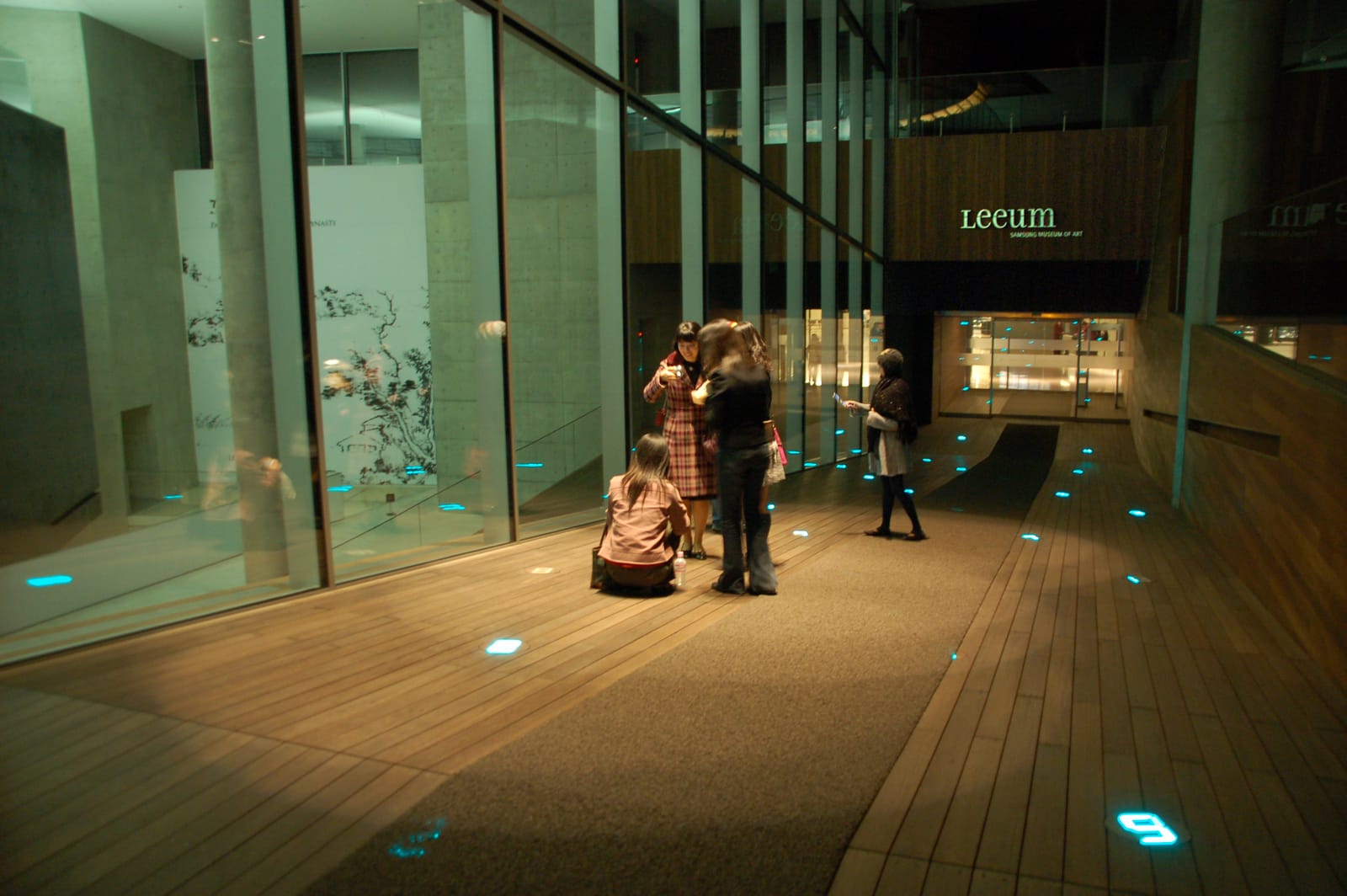 Interior atrium of the Leeum Museum of Art in Seoul with the Leeum sign visible in the background.