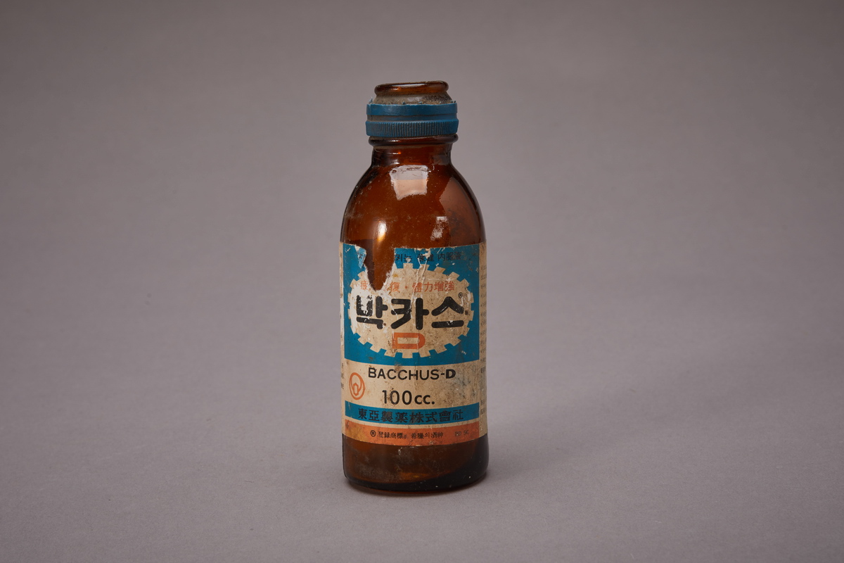 A 1970s Bacchus-D glass bottle with the label reading BACCHUS-D and 100cc.