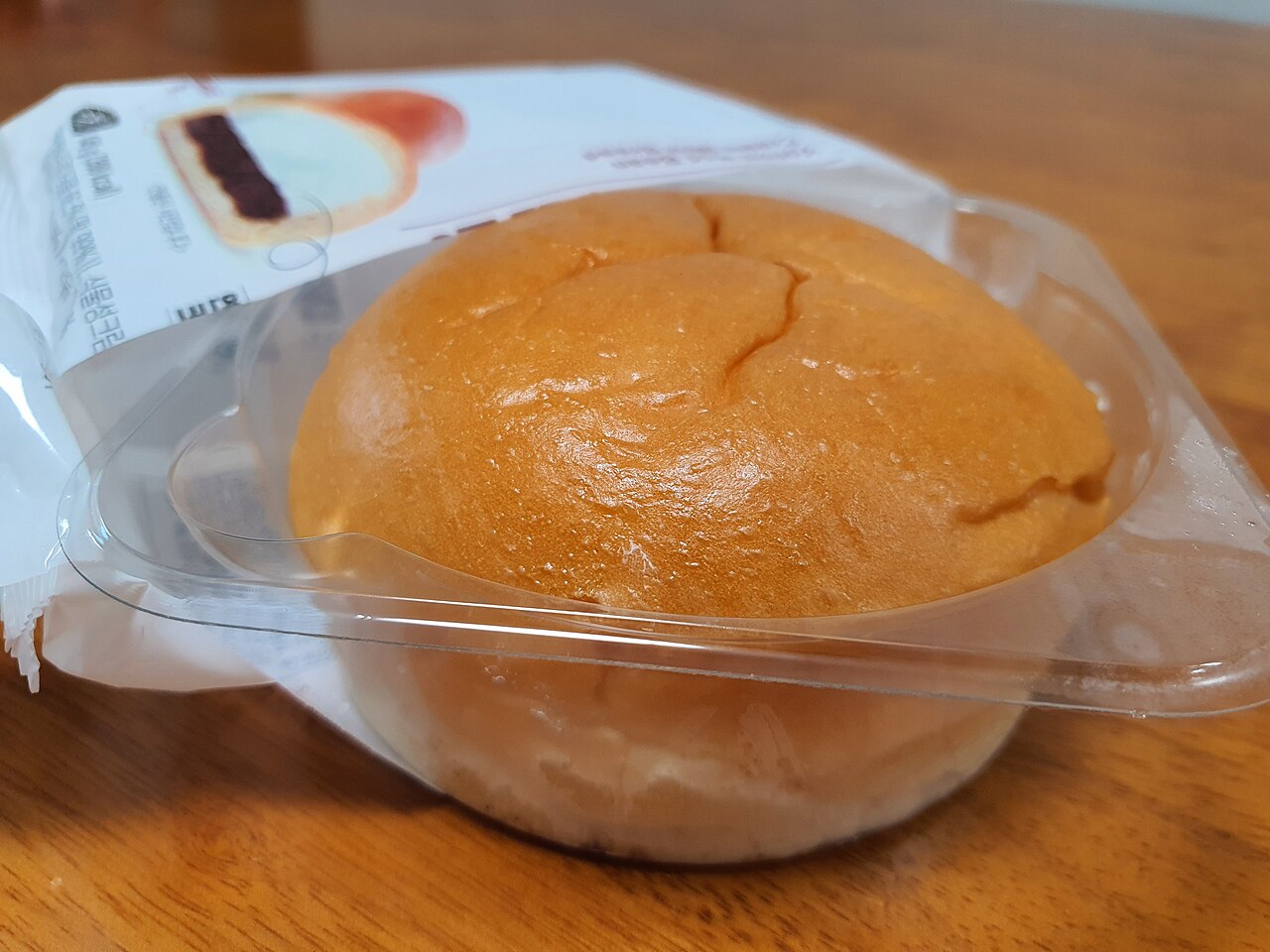 A packaged Yonsei red bean cream bread in its clear convenience store tray with the Korean label visible.