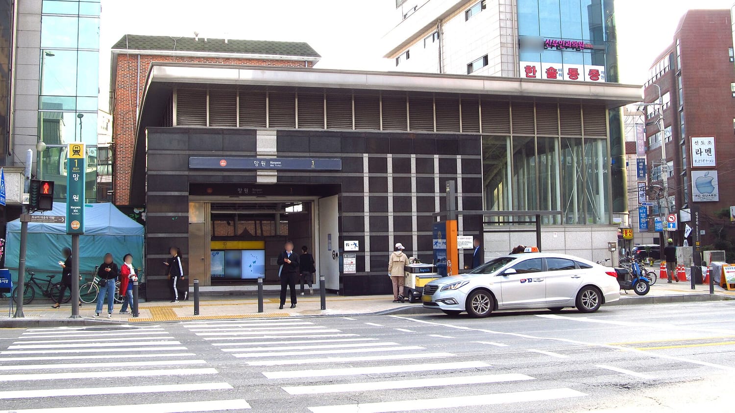 Mangwon Station on Seoul Metro Line 6, its street-level entrance with signage.
