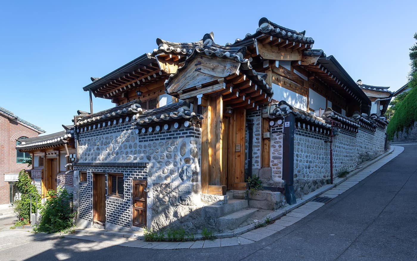 Hanok houses on the corner of a steeply sloping street in Bukchon.