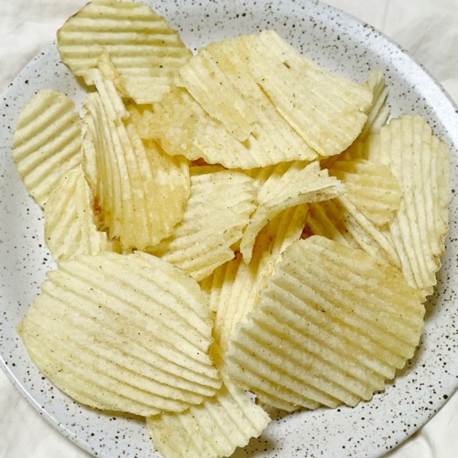 A bowl of Swing Chip — thick chips with deep parallel ridges.