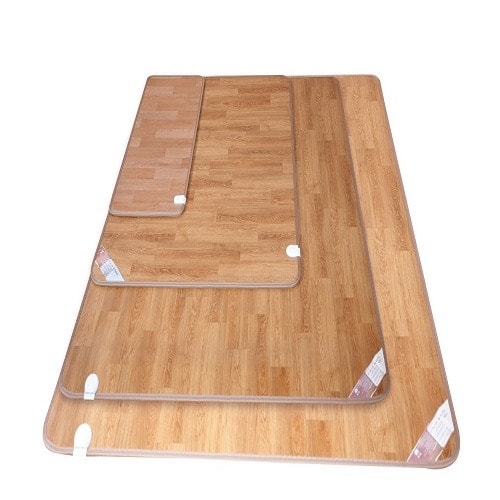 Four Ilwol Deomaru Plus carpet mats in nested sizes, printed to look like wood flooring, each with a white connector socket on its edge.
