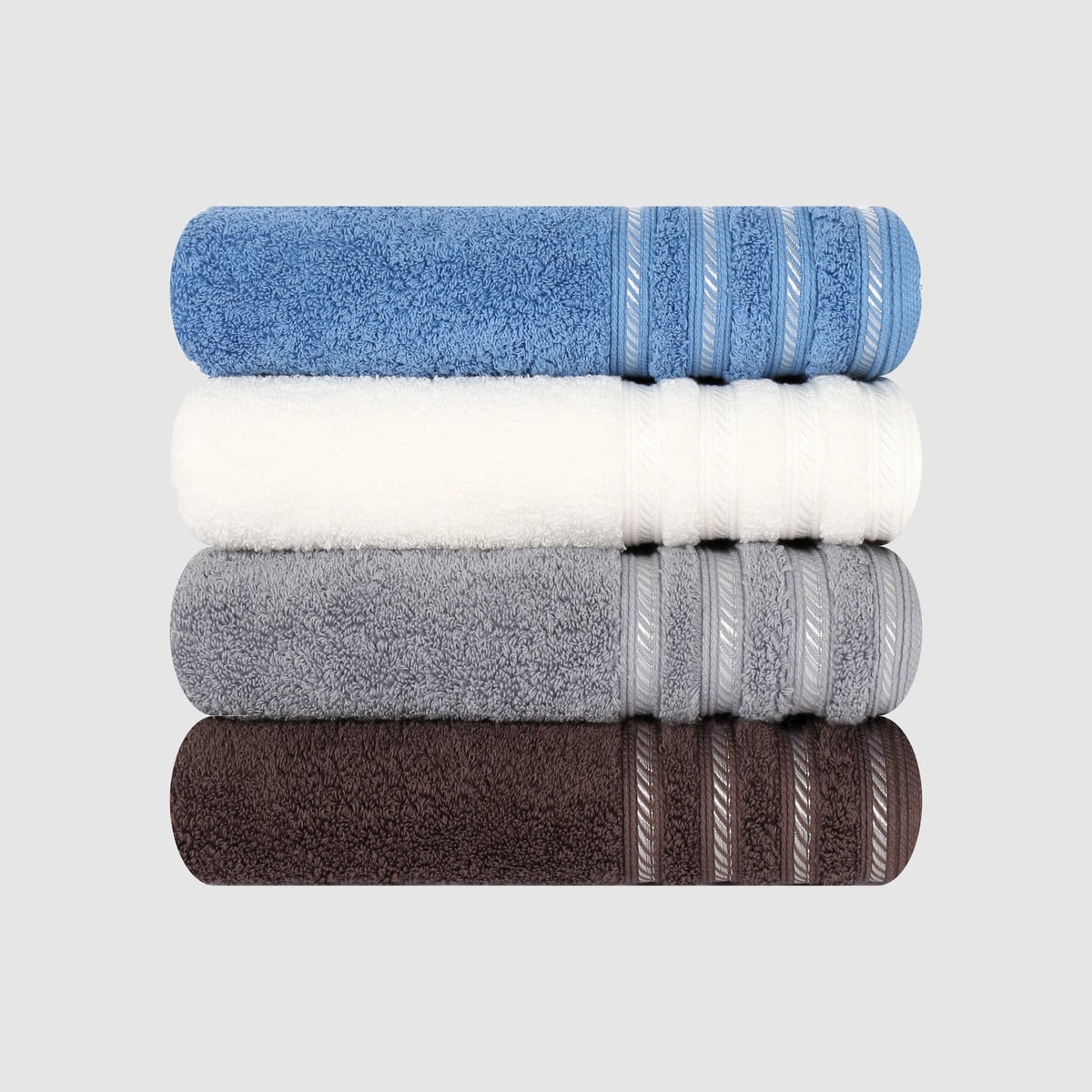Four folded Songwol towels stacked — cornflower blue, cream, grey and dark brown — each with a woven decorative border band.