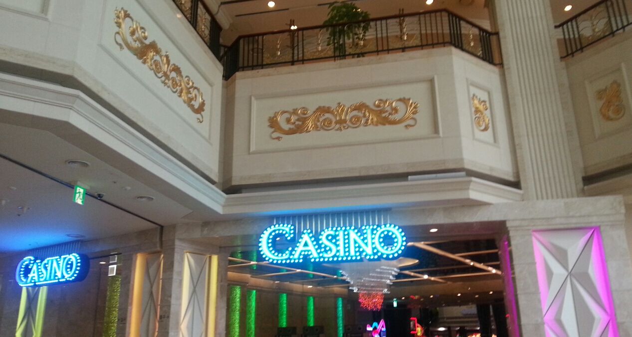 The entrance to the Kangwon Land casino floor in Jeongseon, Gangwon: a marble doorway with a lit CASINO sign.